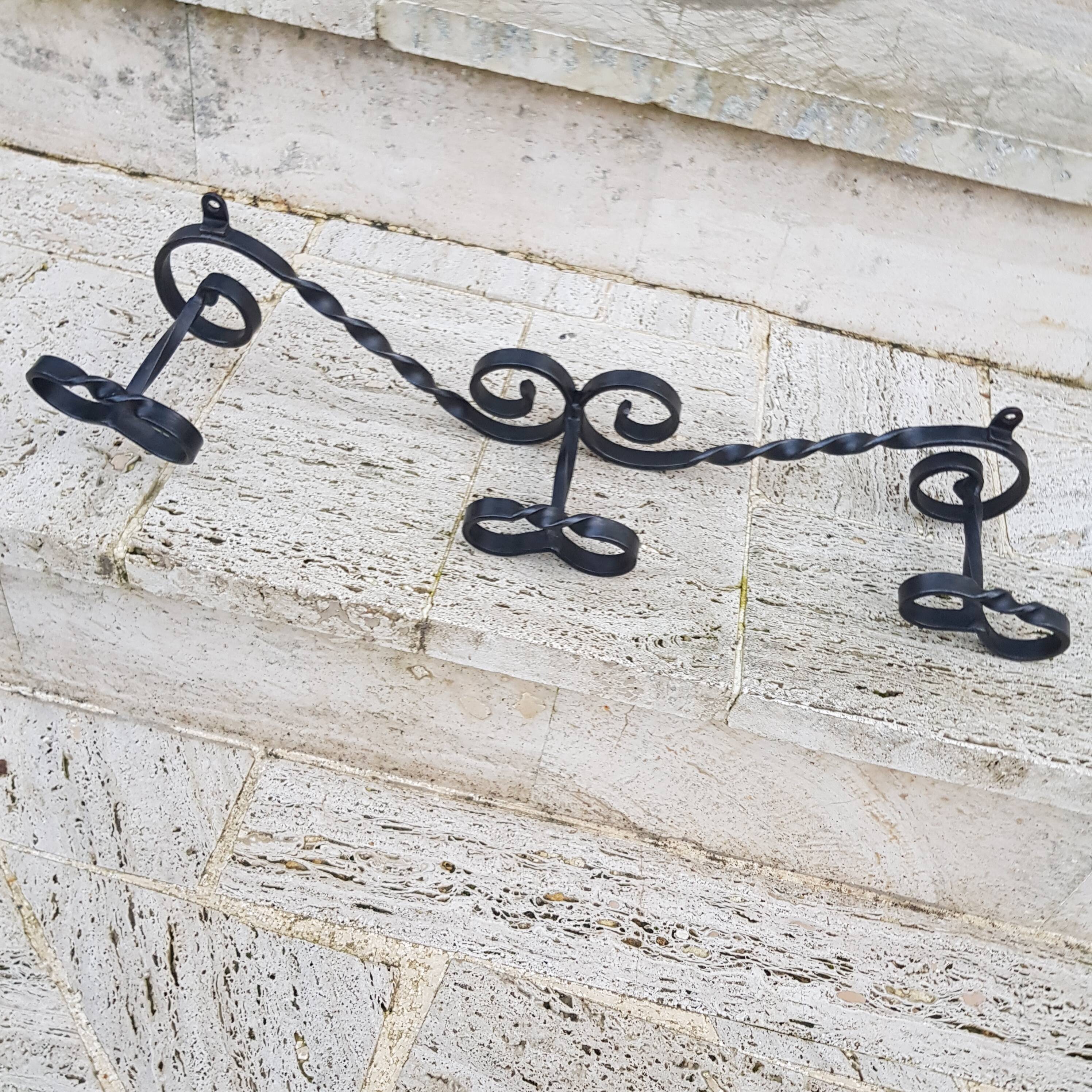Wrought iron wall coat rack