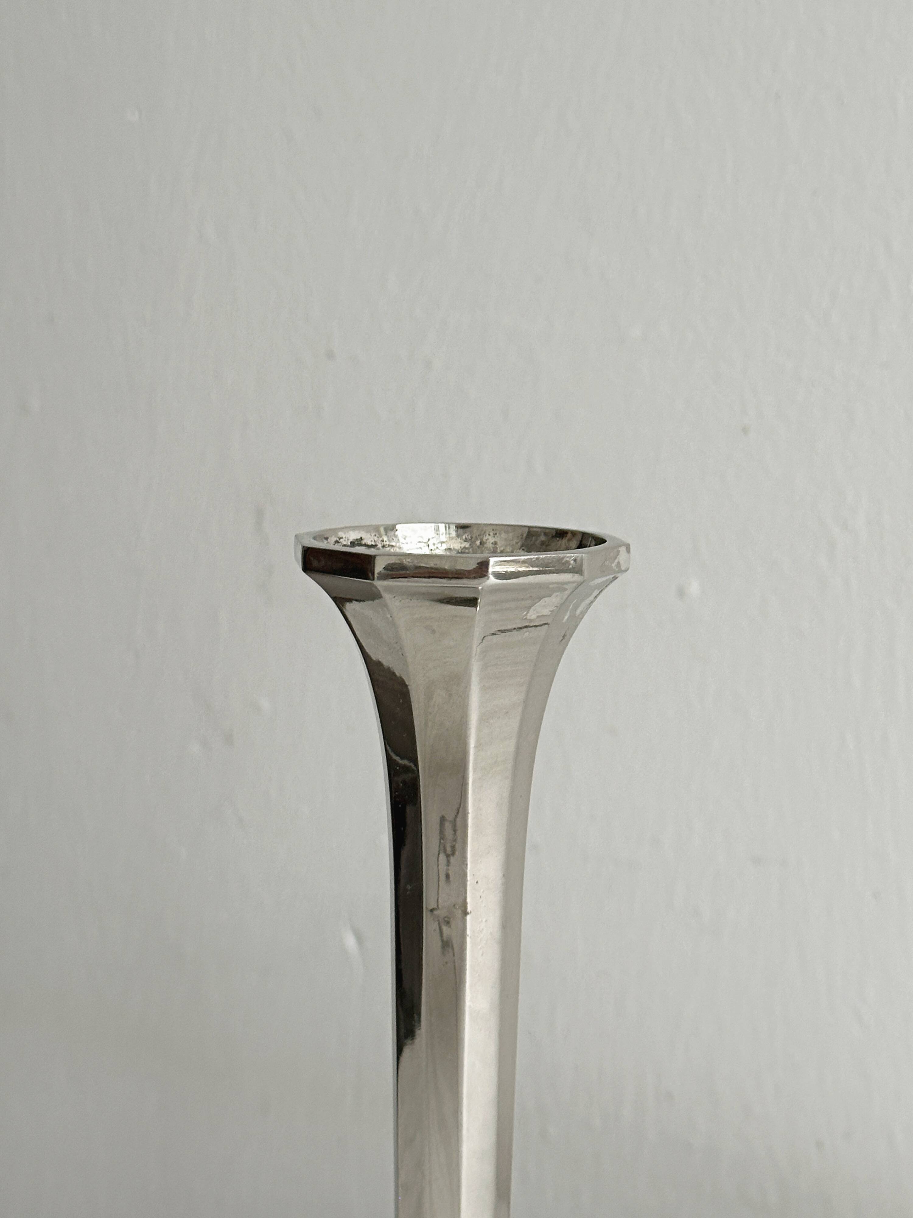 single flower vase or metal candlestick