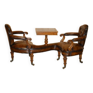 High Victorian leather tête-à-tête canapé with a walnut burr chessboard.