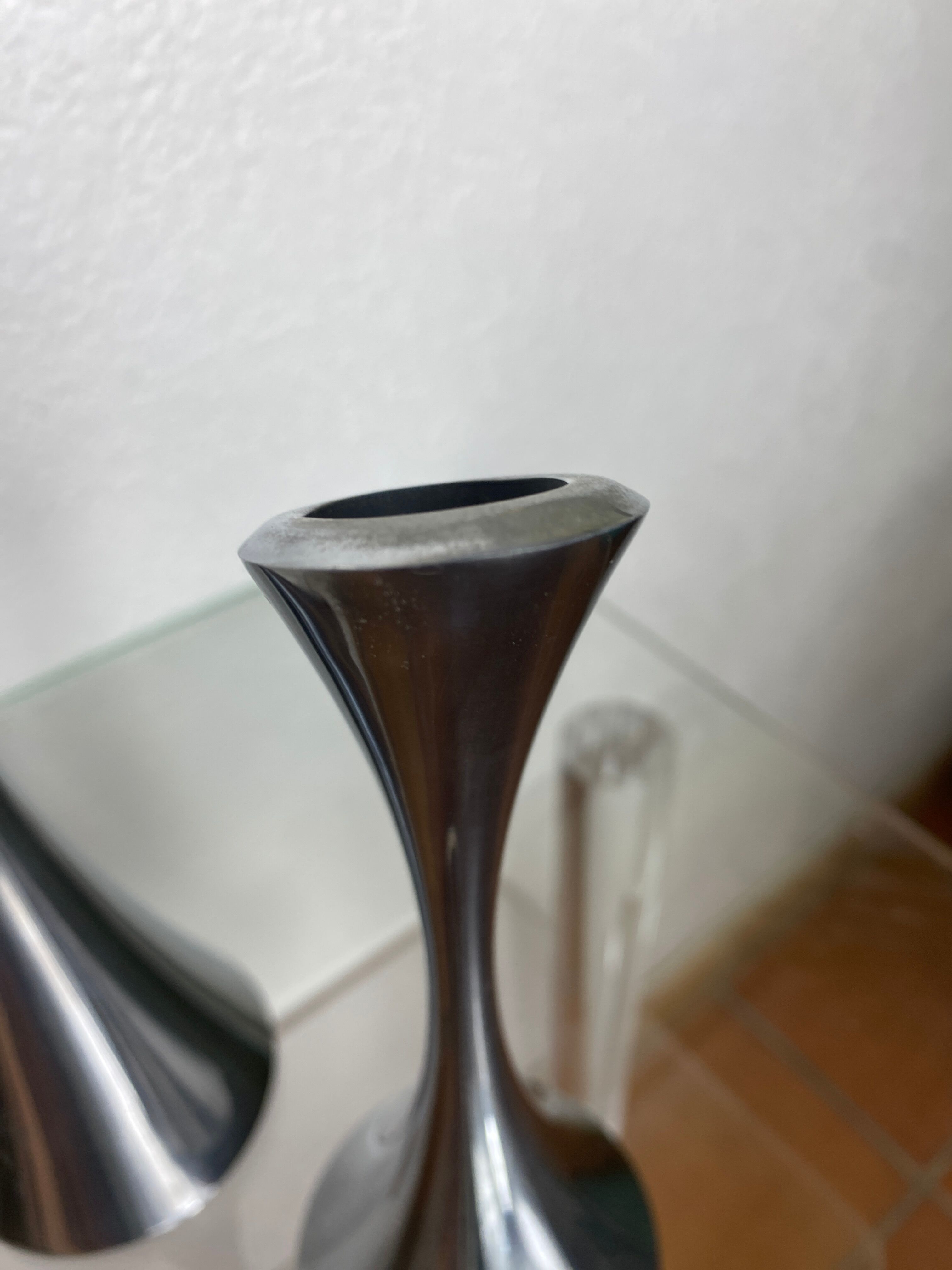 Pair of designer candle holders in stainless steel