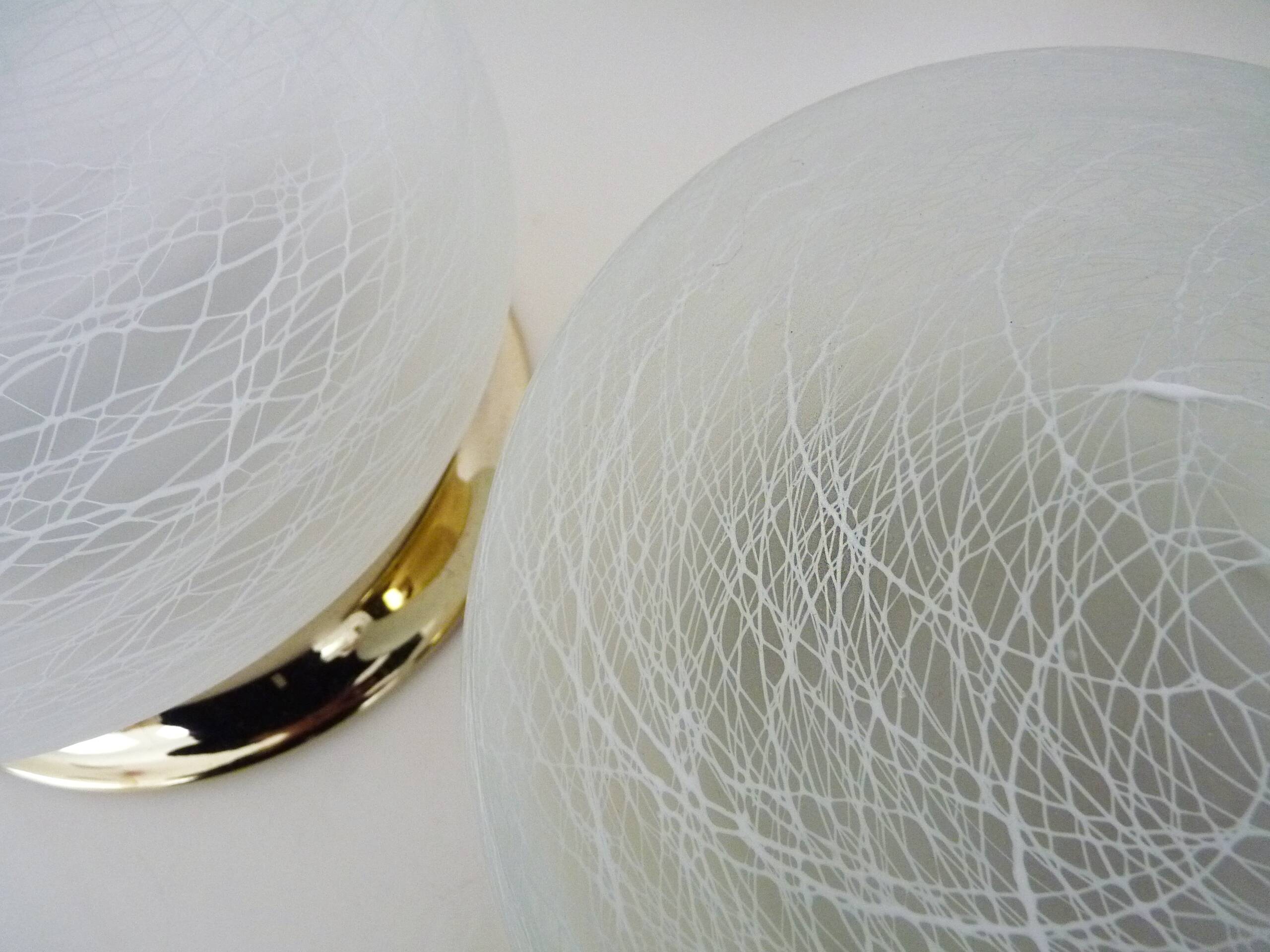 Pair of wall or ceiling lights with white-edged globe. 80 years