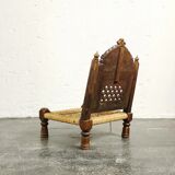 Ancient ethnic chair made of solid wood and rope