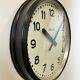 Black swiss industrial wall clock from inducta, 1960s