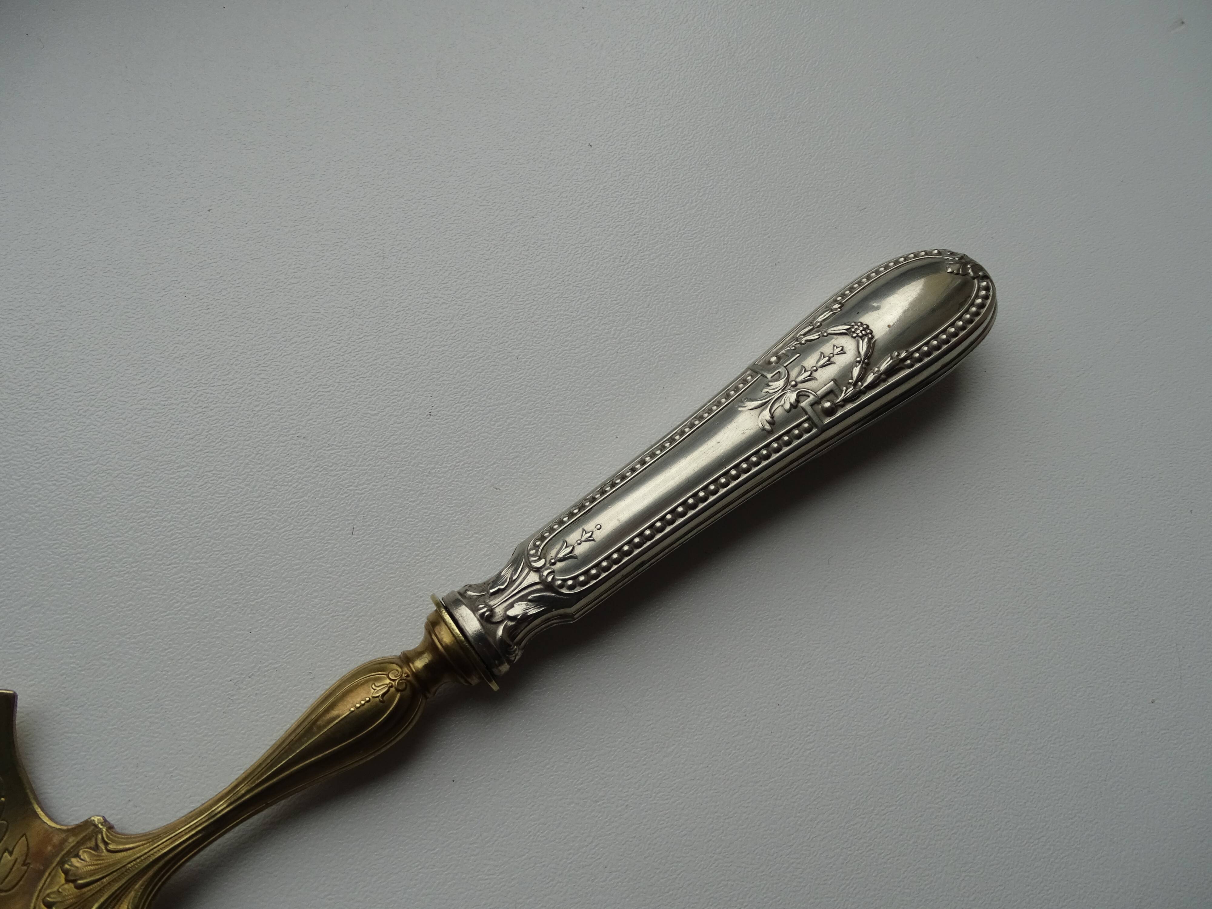Openwork pie shovel with silver and gold metal hallmarked
