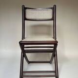 Set de quatre chaises pliantes en bois et cannage