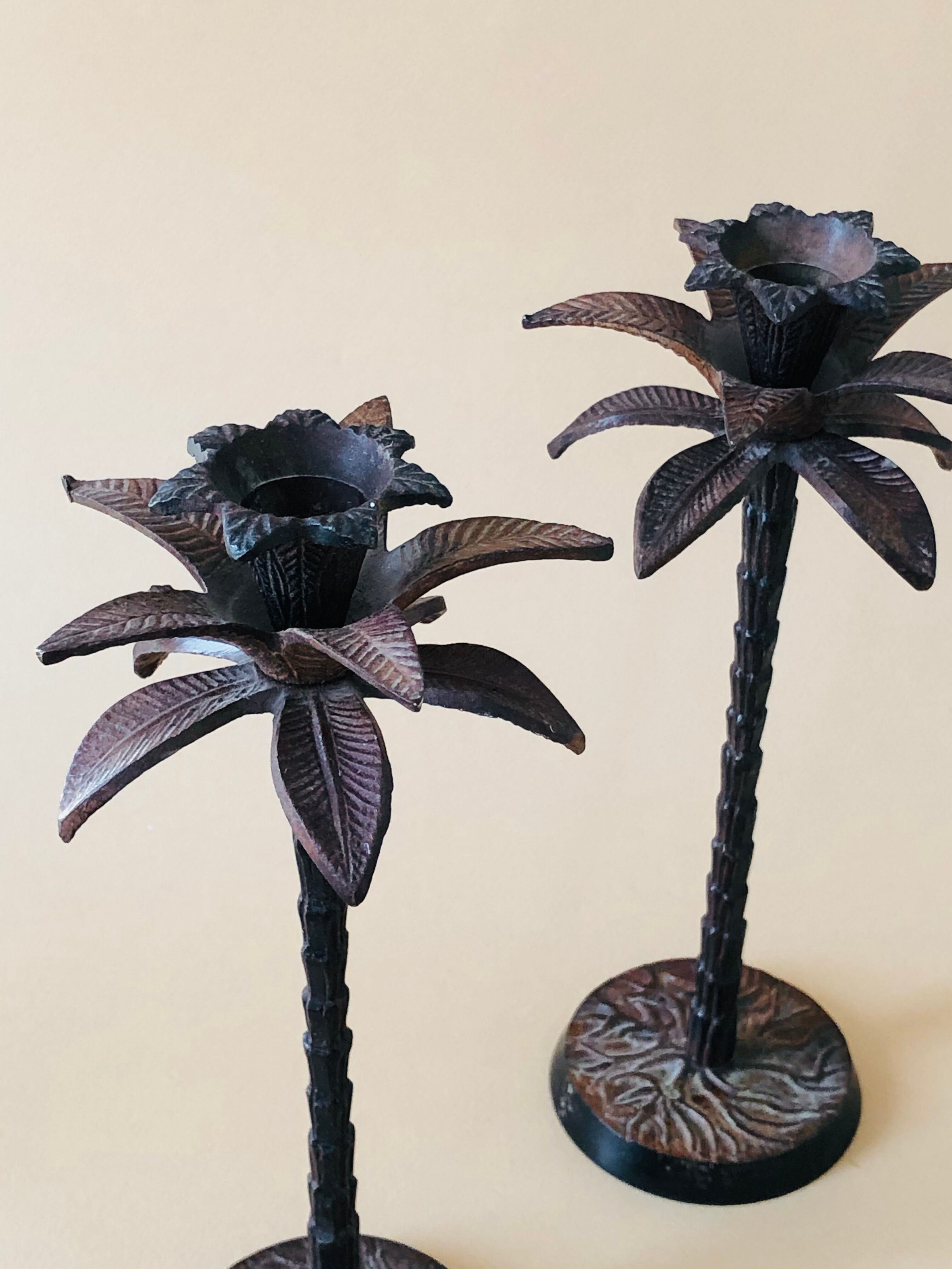 Pair of patinated metal candlesticks