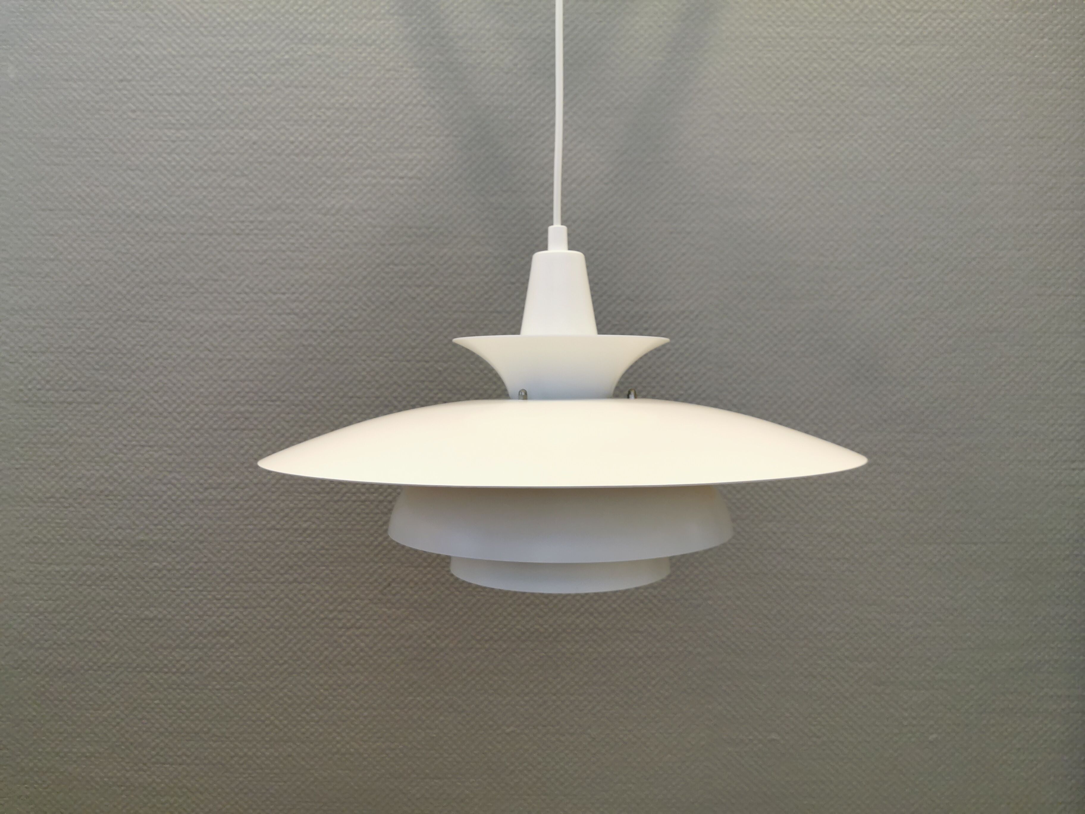 Classic danish designed hanging lamp from the 80s, in white lacquered metal