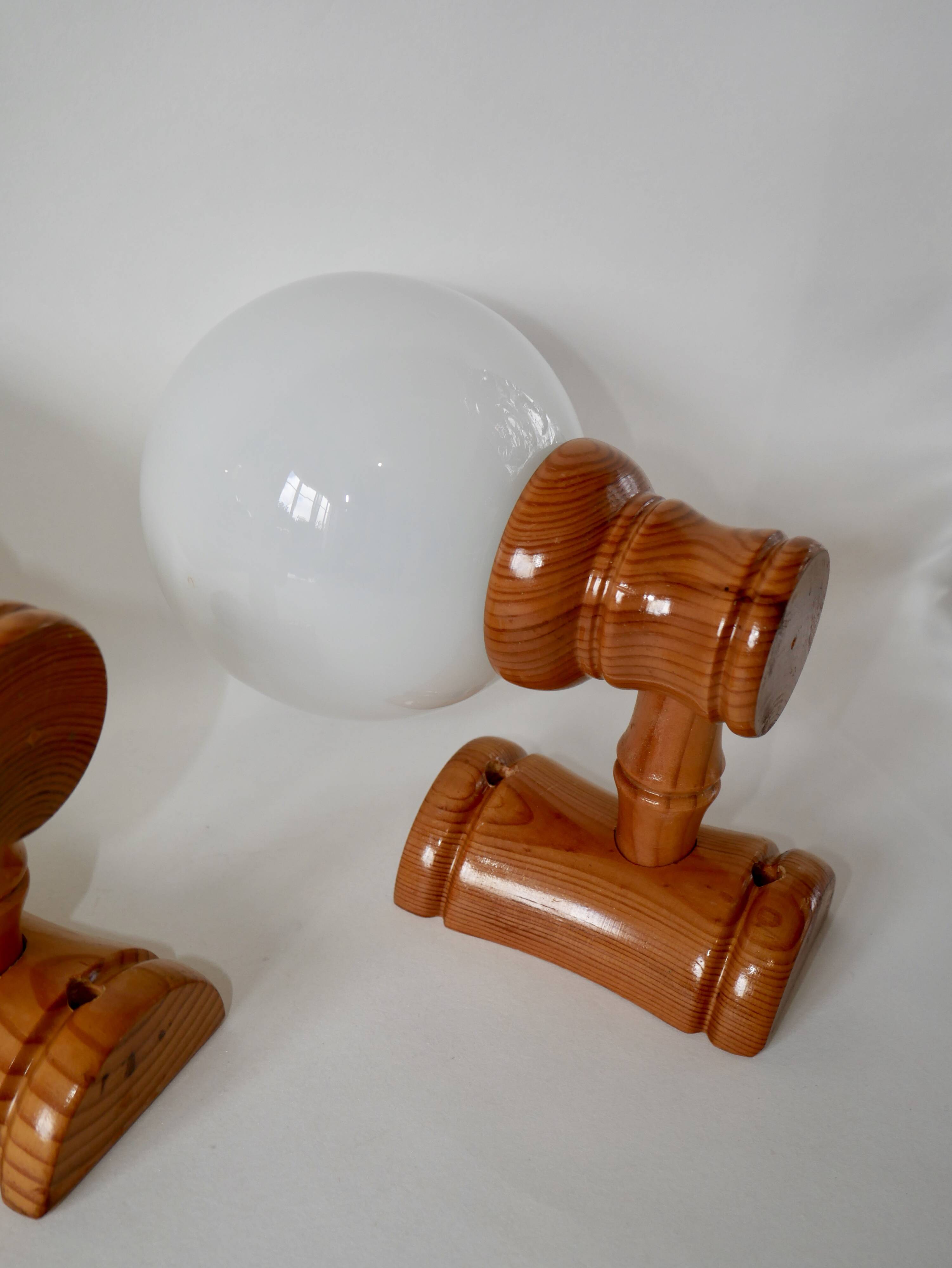 Pair of globe wall lights in pine and opaline from the 60s