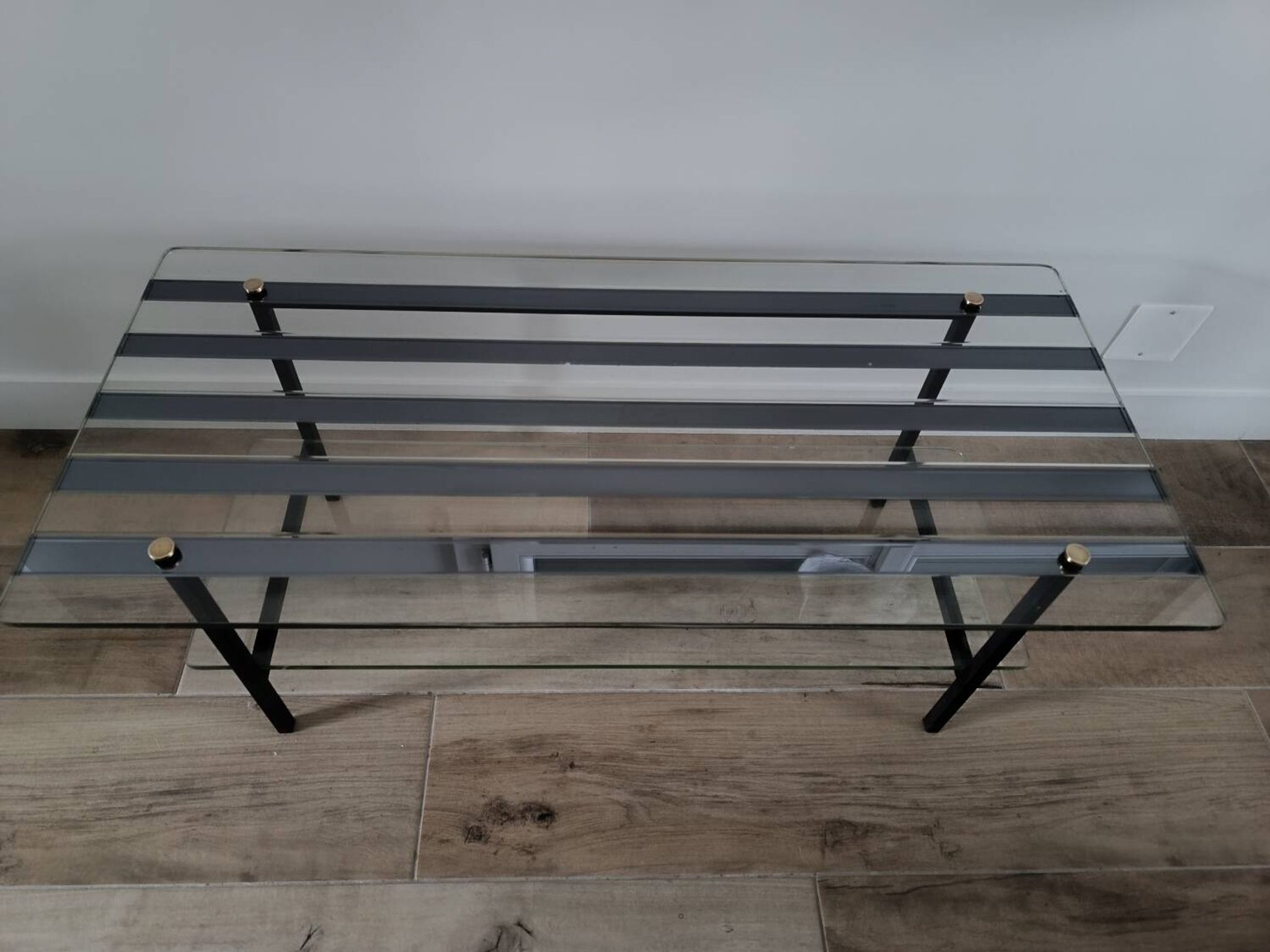 Vintage coffee table in glass and mirror strips.