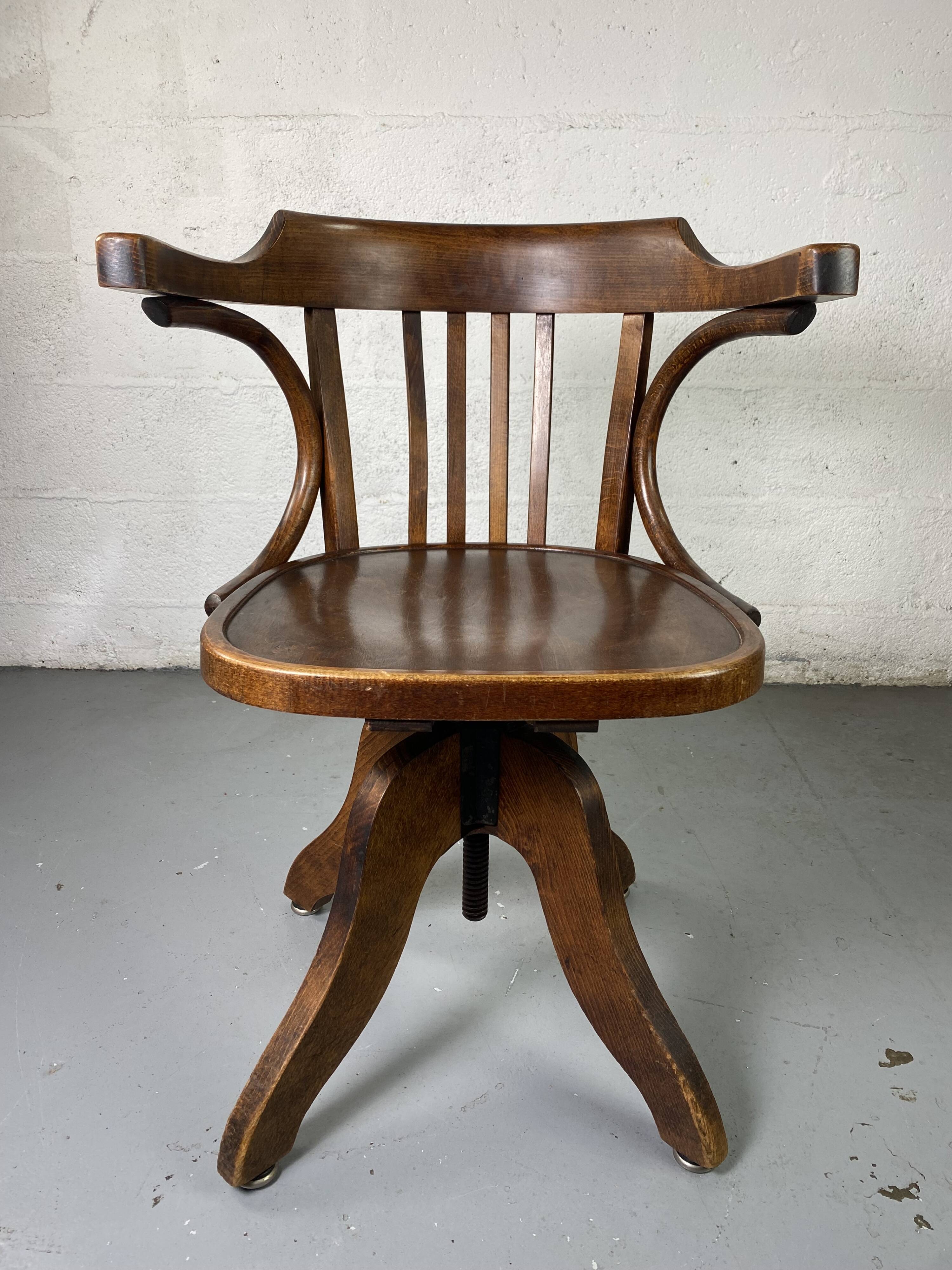 Baumann rotating wooden armchair