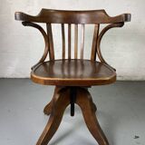 Baumann rotating wooden armchair