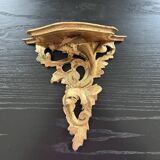 Golden console in rococo style