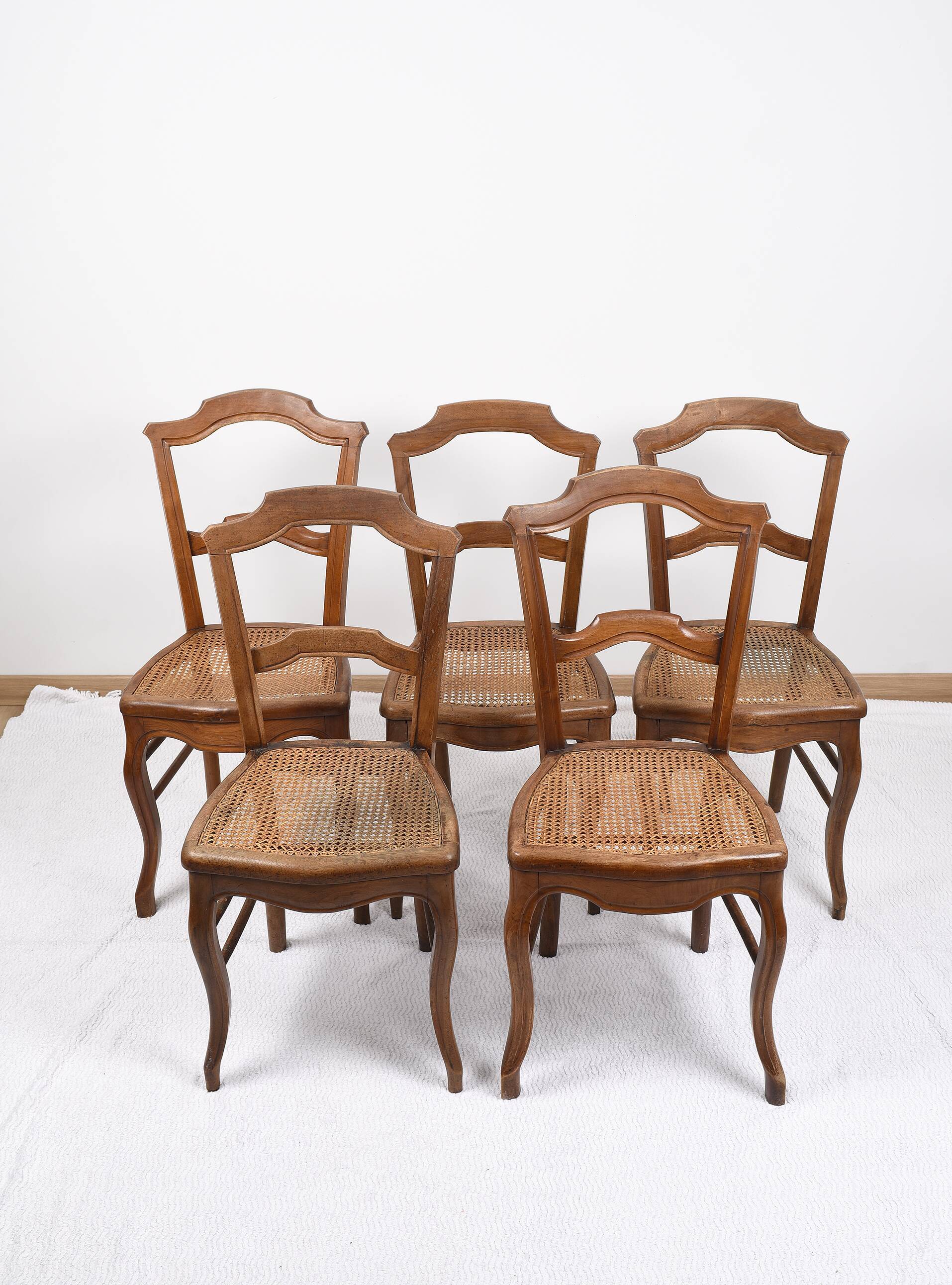 Set of 5 old cane chairs.