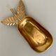 Empty vintage pear-shaped brass pocket