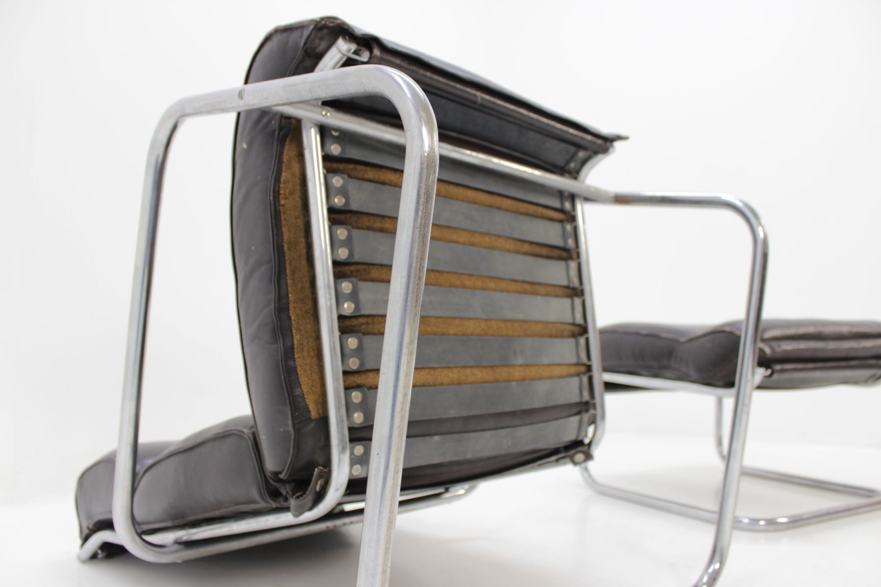 Chair and Ottoman in leather 1950 s