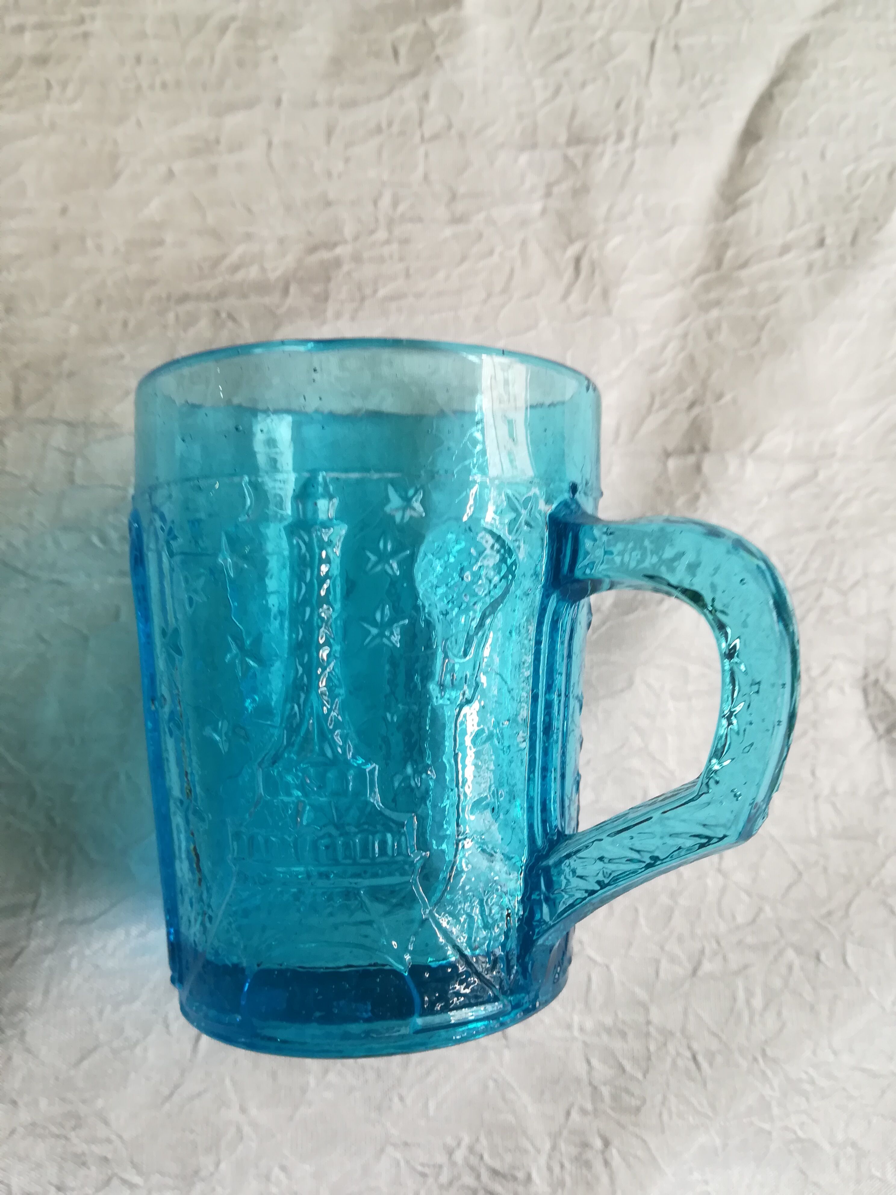 Old turquoise glass cup