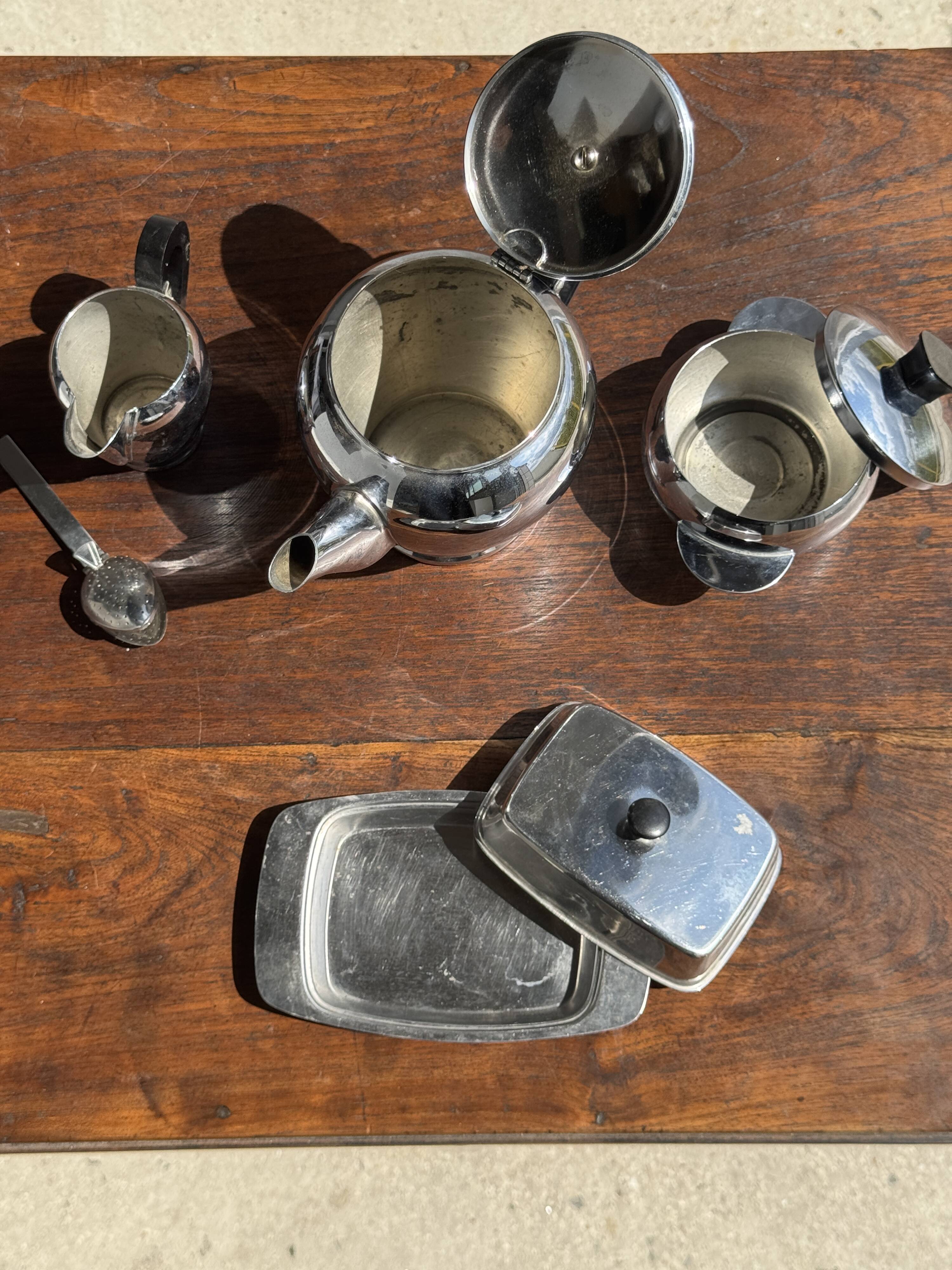 Tea set including teapot, milk jug, sugar bowl and butter dish