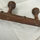 Wooden coat rack turned two hooks