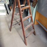 Old wooden stepladder shelf decoration
