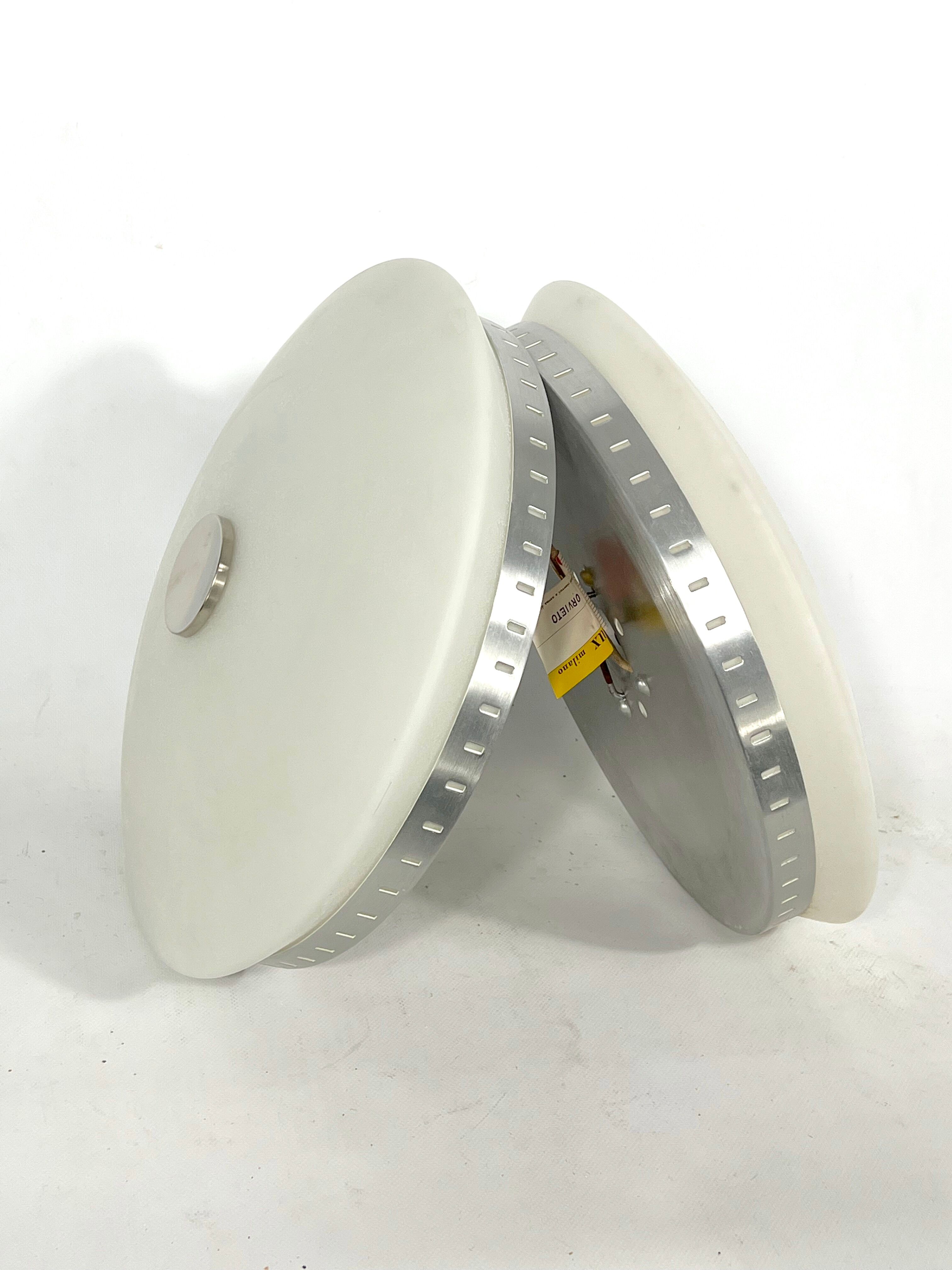 Stilux Milano, pair of round opaline glass ceiling lamps. 1960s