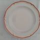 Set of 12 stylised white porcelain dinner plates, signed.