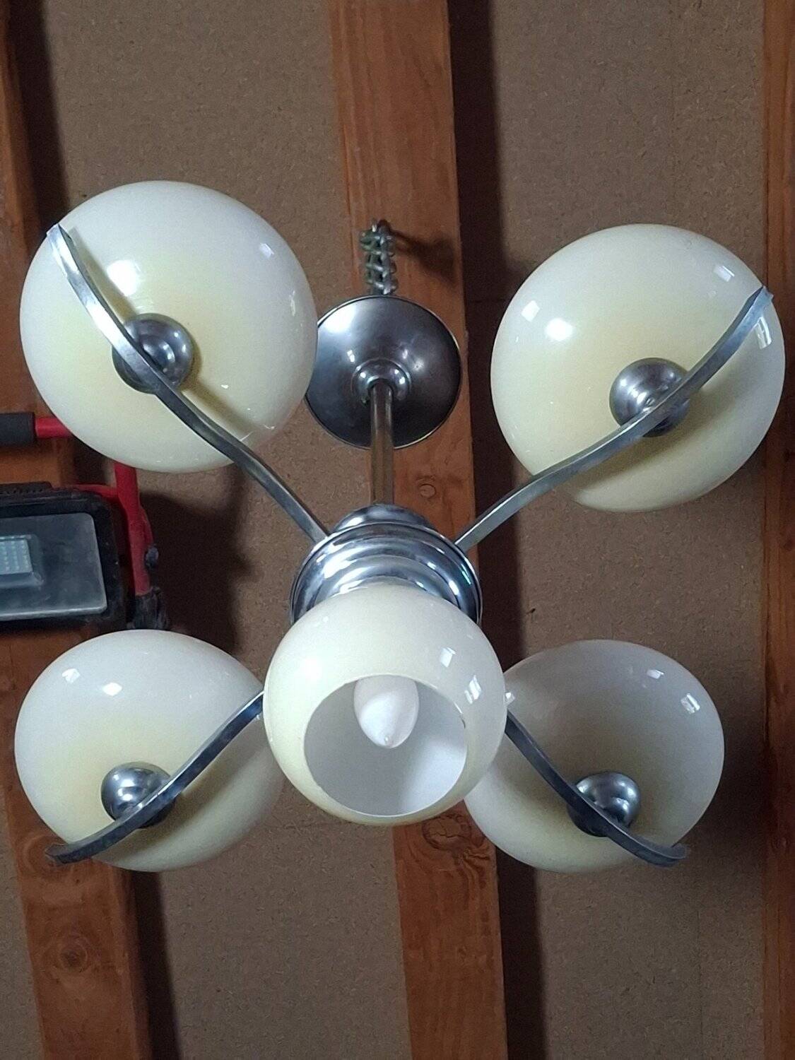 Chrome metal chandelier with 5 pale yellow opal shades from the 1950s.