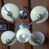 Chrome metal chandelier with 5 pale yellow opal shades from the 1950s.