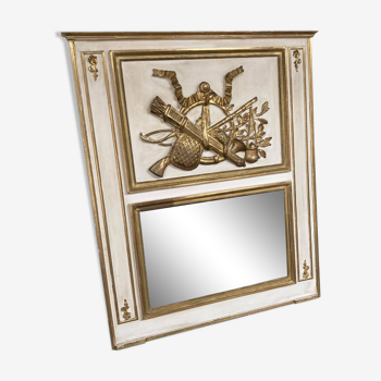 Mirror decorated with weapons