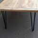 Wooden coffee table with pin legs