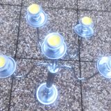 Standing candlestick in stainless steel metal with 5 movable branches, with smooth ring for 4 cm candles.