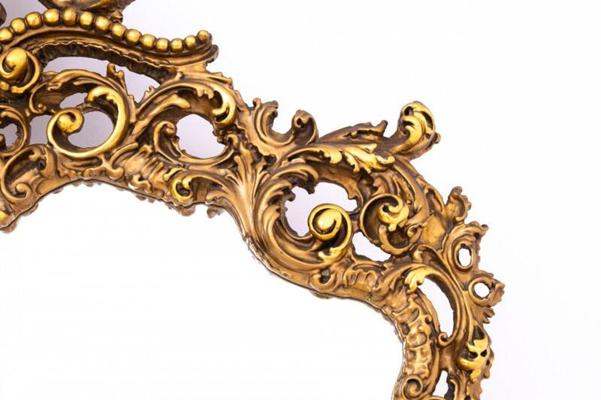 A large mirror in a gold frame, Italy, first half of the 20th century.