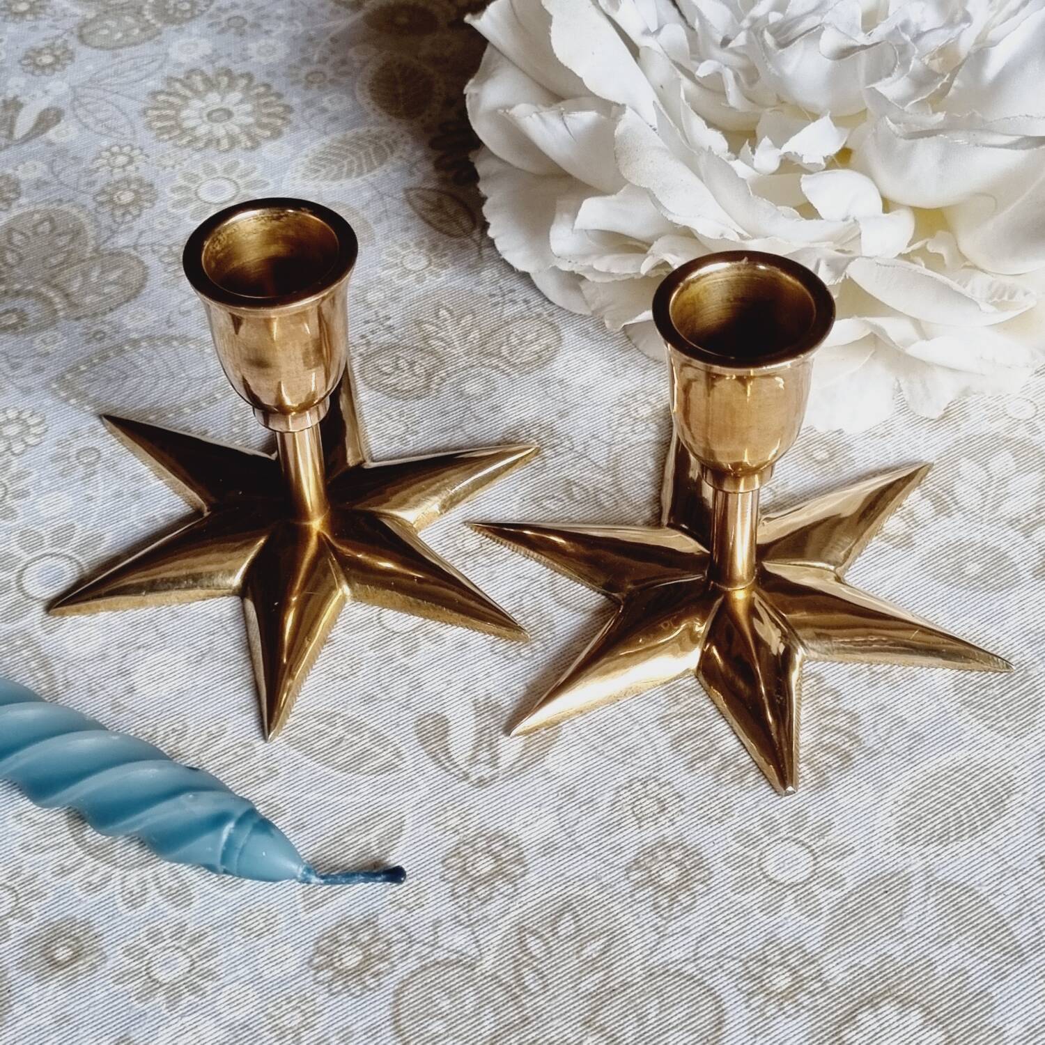 Duo of brass star candlesticks