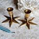 Duo of brass star candlesticks