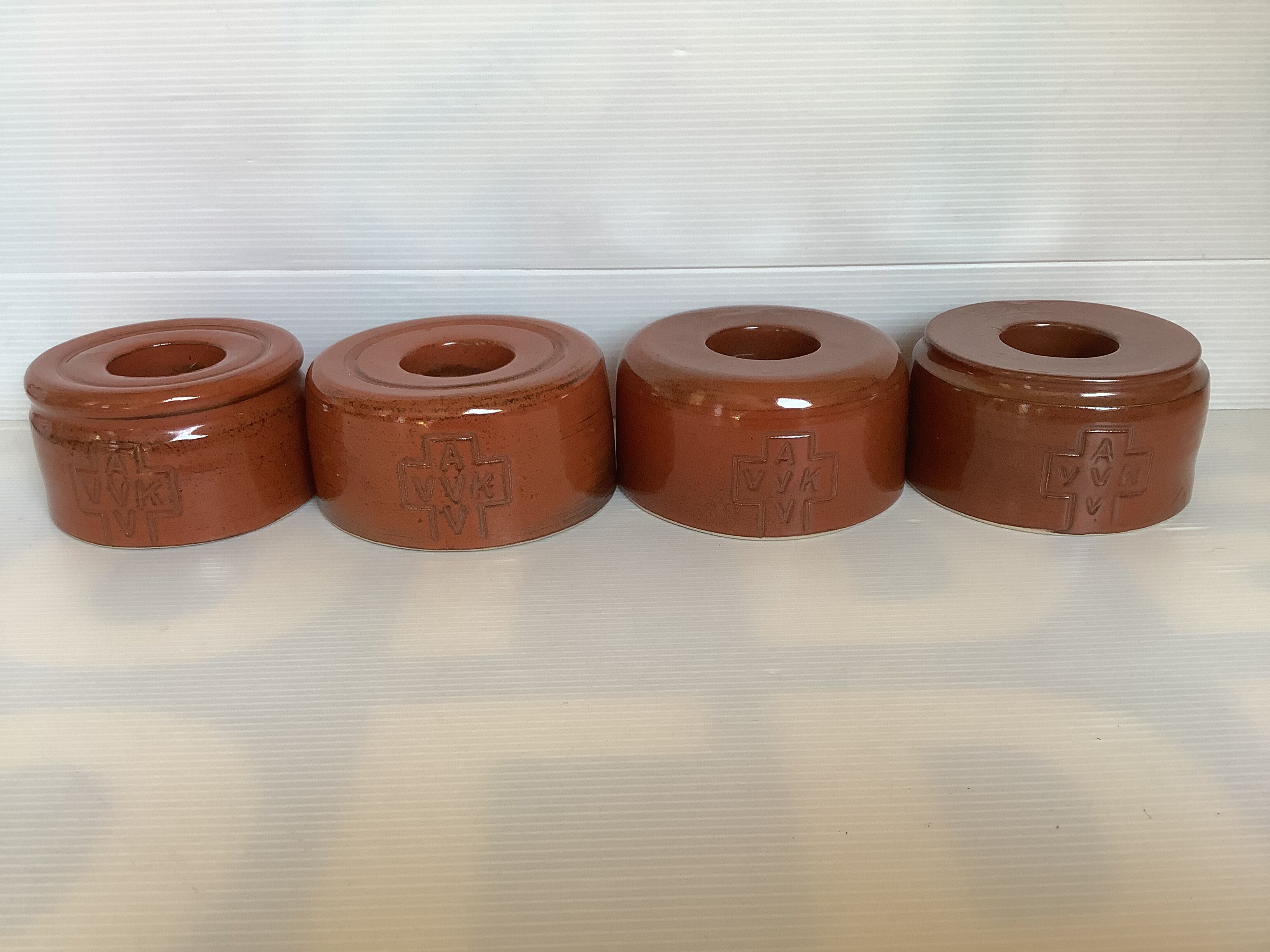 Four ceramic candlesticks AVV VVK Yser Tower Dixmude