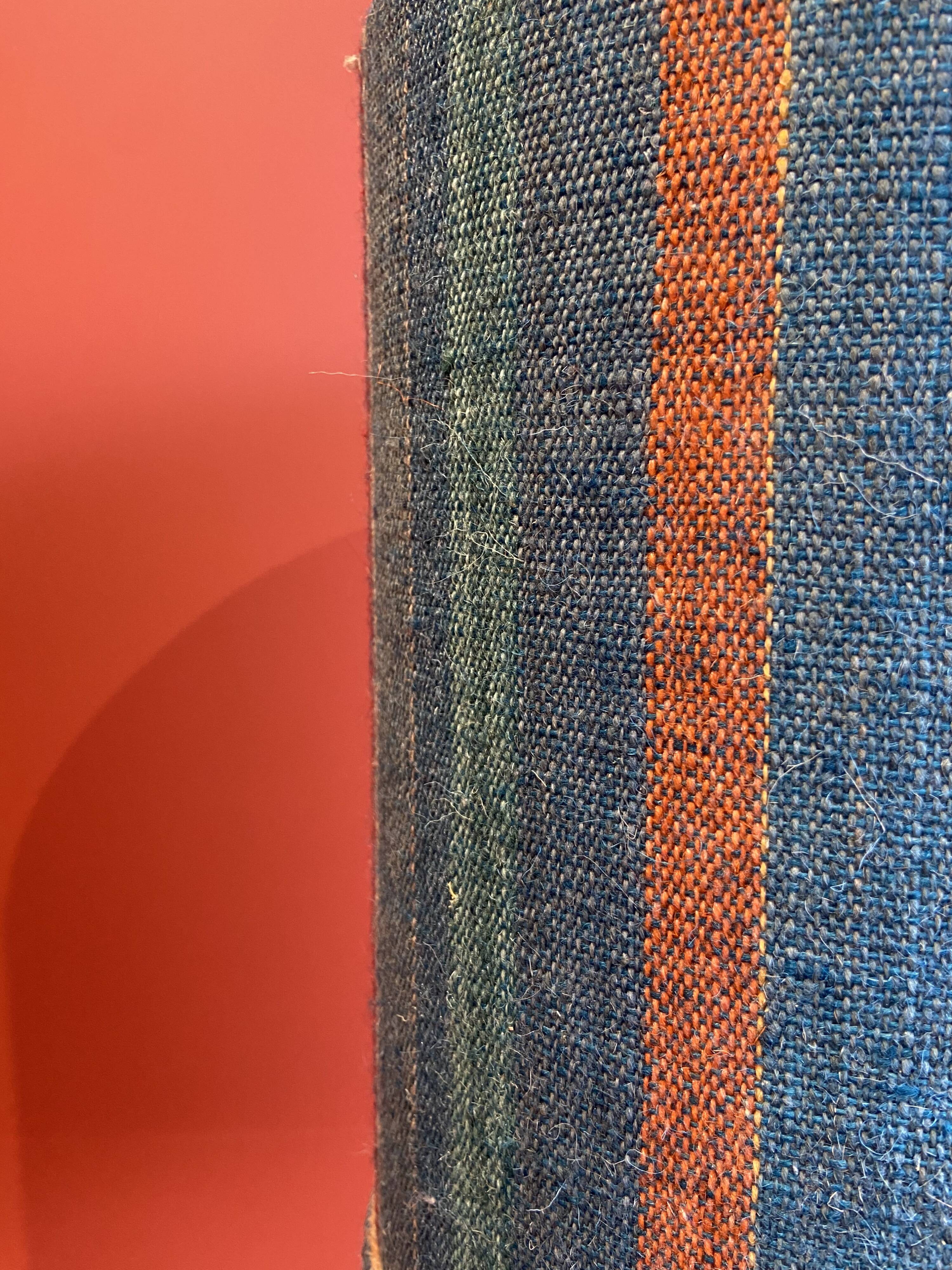 "Stoneware Bottle Lamp" with a multicoloured blue lampshade handwoven in India.