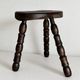 Restored dark wood tripod stool, bobbin leg, elegant furniture.