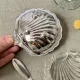Metal shell butter dish with glass bowl and knife