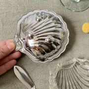 Metal shell butter dish with glass bowl and knife