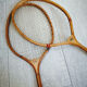 Pair of old wooden badminton rackets
