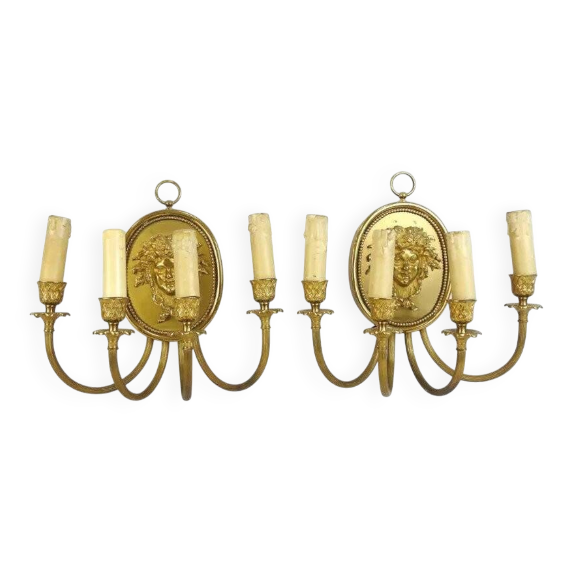 Pair of wall sconces with a relief decoration of a Bacchus mask.