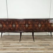 Mid-century mahogany buffet with teal glass and compartments with a drawer.