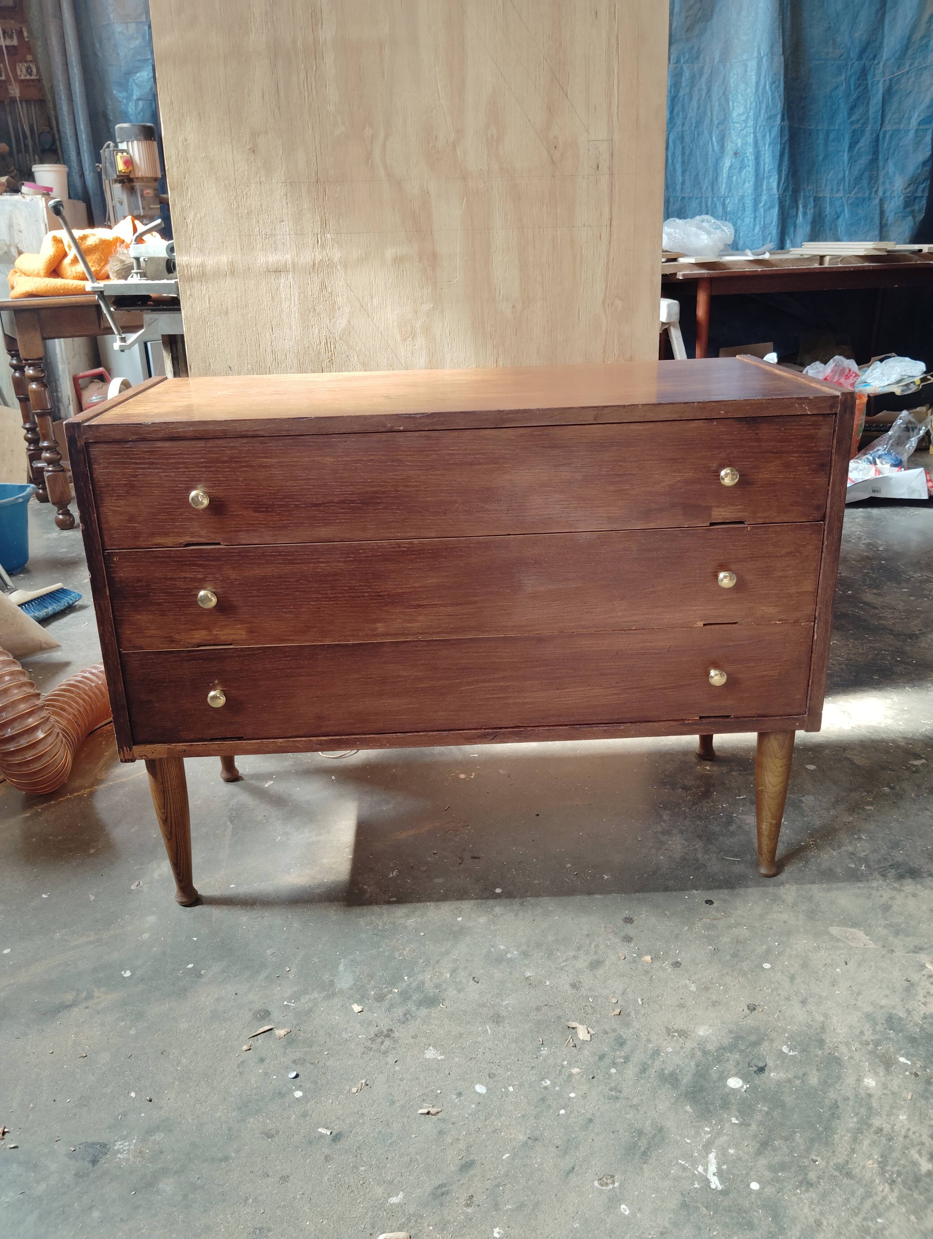 Vintage commode with tapered legs.
