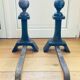 Pair of massive antique-style fire dogs in solid iron from the 20th century.