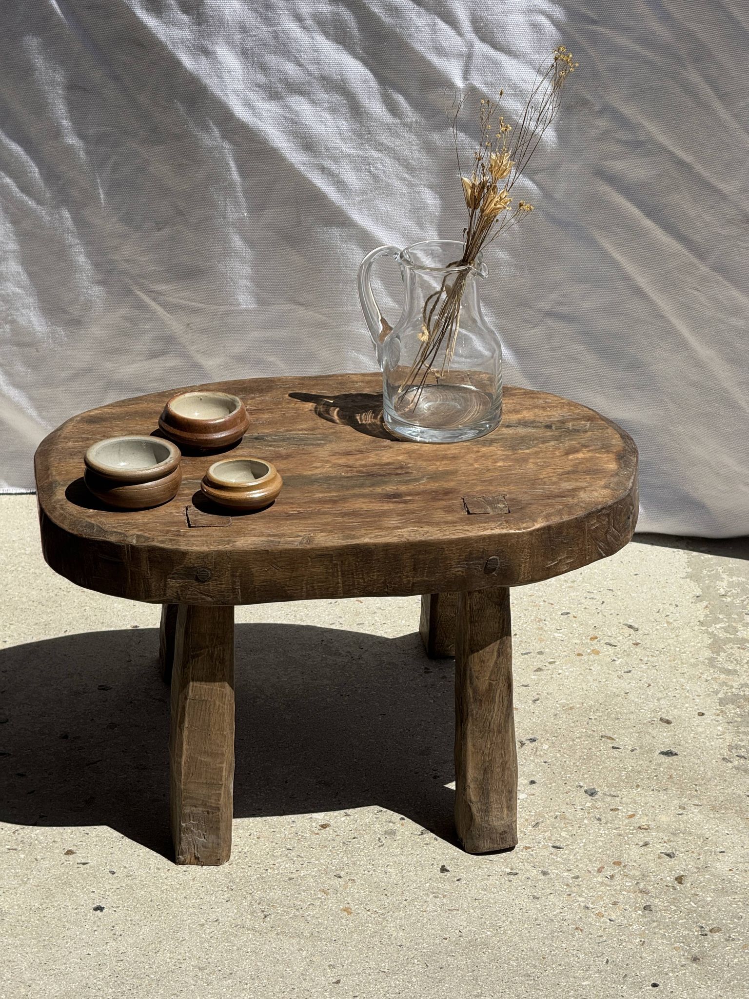 Small stool, oval solid teak accent stool with a two-tone seat.