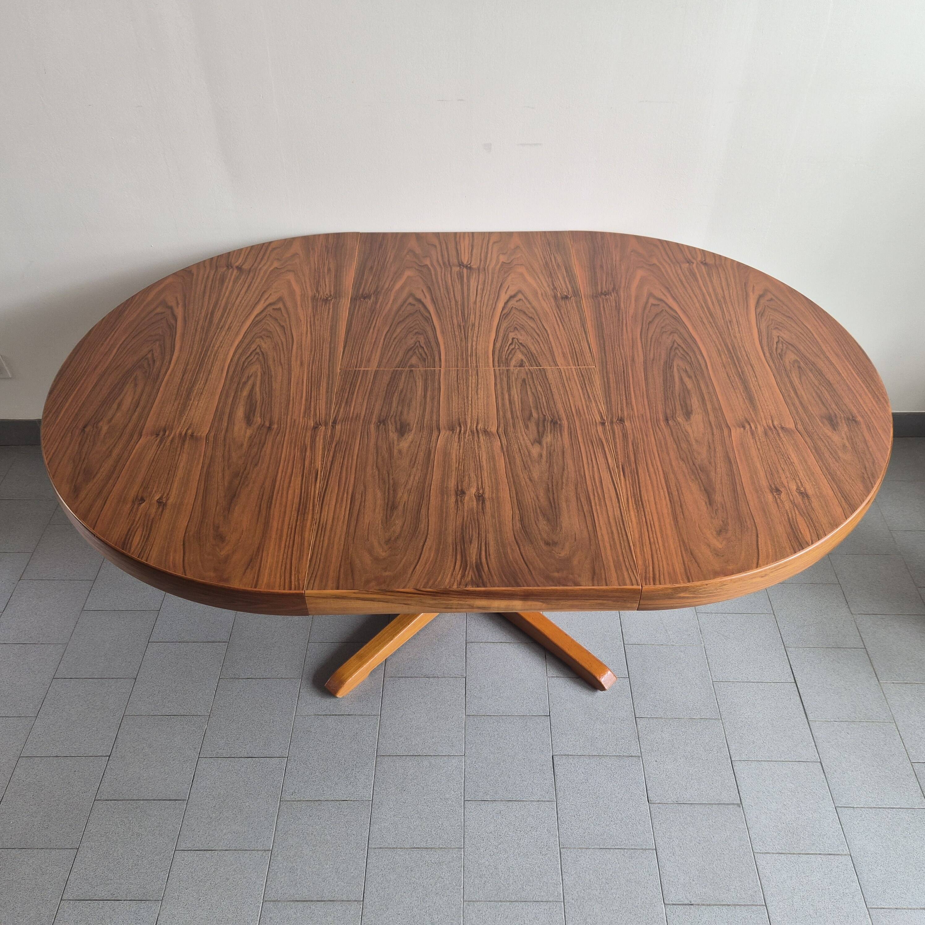 Baumann dining table 1960 extendable from 114 to 167 cm with integrated extensions.