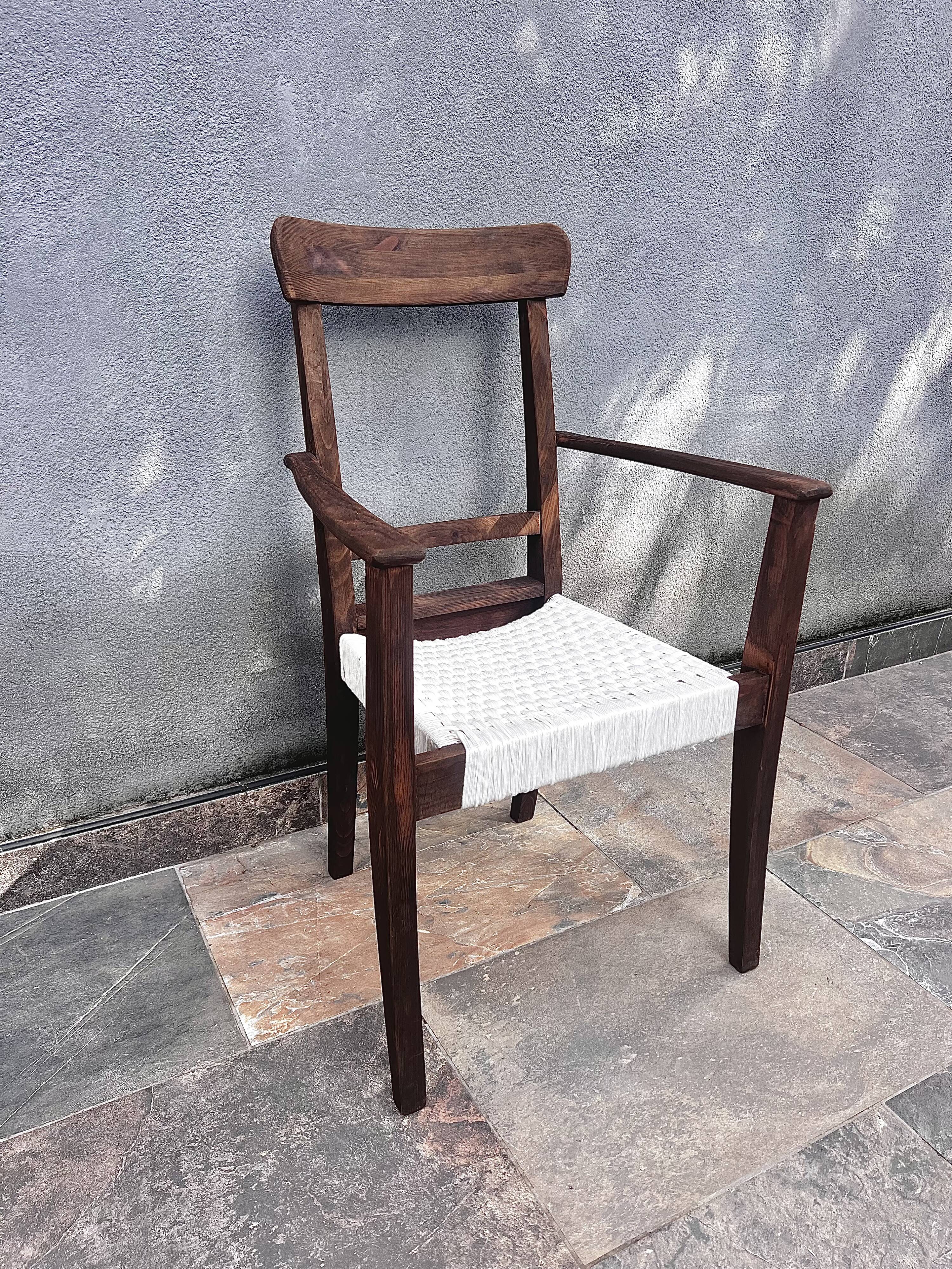 Scandinavian chair in wood and woven natural fibre.