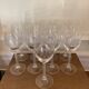 Set of 9 tall twisted and engraved crystal wine glasses