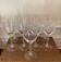 Set of 9 tall twisted and engraved crystal wine glasses