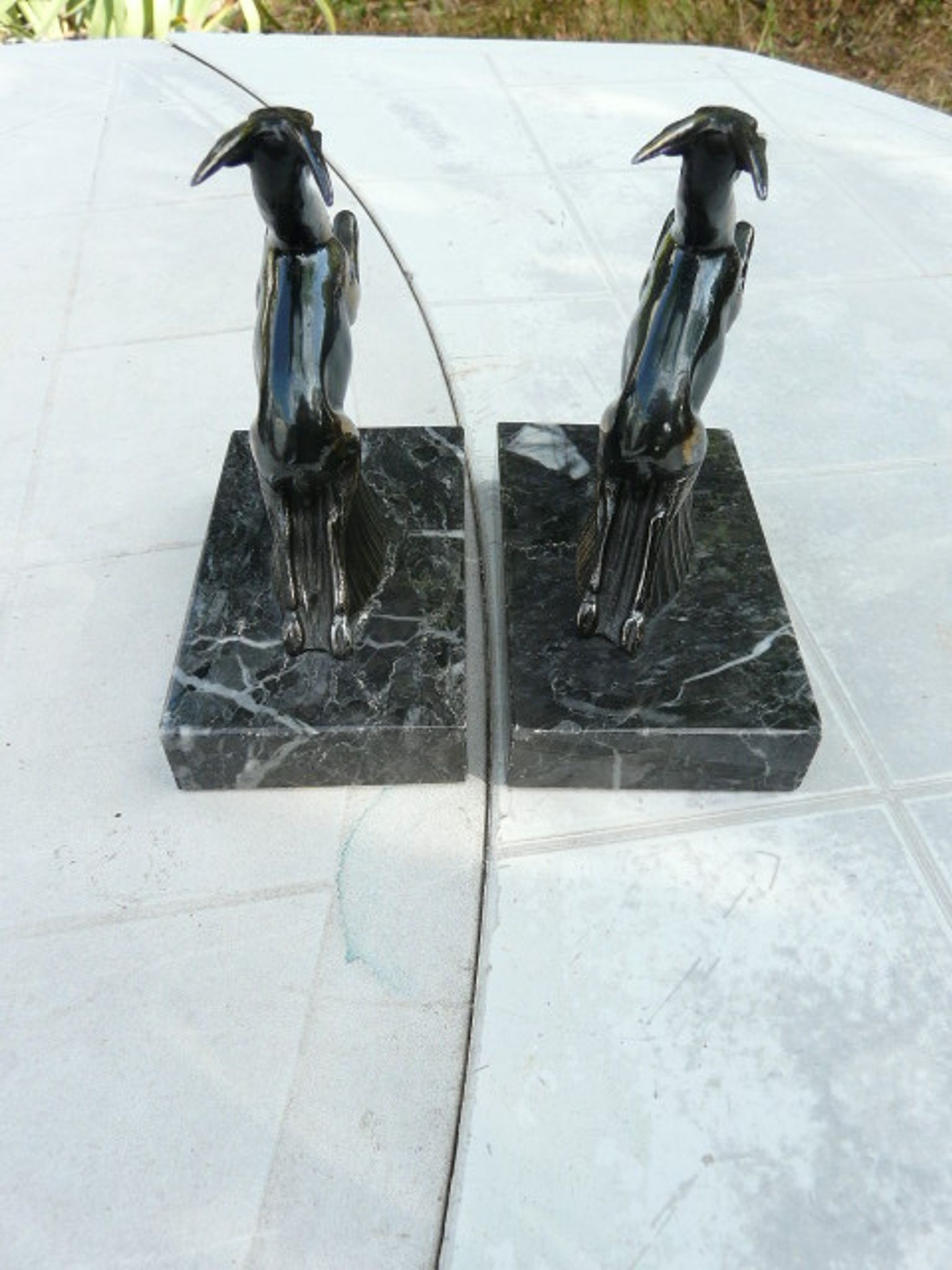 Pair of greenhouse book antelope in regulation on marble base