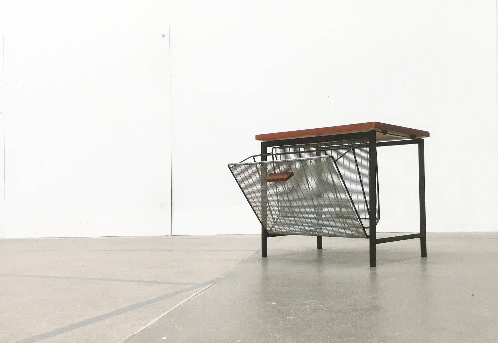 Mid-century teak side table with magazine rack.